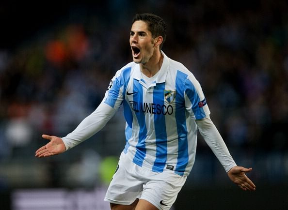 Isco of Malaga CF celebrates scoring his sides opening goal during the UEFA Champions League Round of 16 second leg match between Malaga CF and FC Porto at La Rosaleda Stadium on March 13, 2013 in Malaga, Spain.